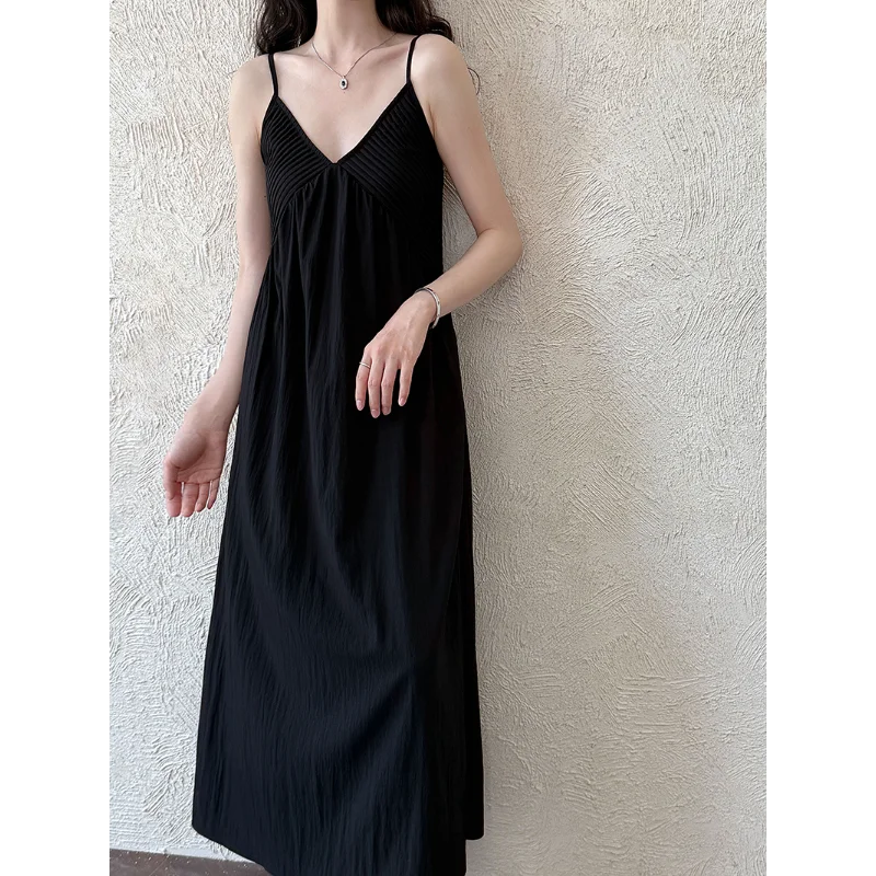 Abito da donna stile vacanza al mare con scollo a V francese Abito da donna senza maniche semplice ed elegante nero bianco sexy per festa di nozze