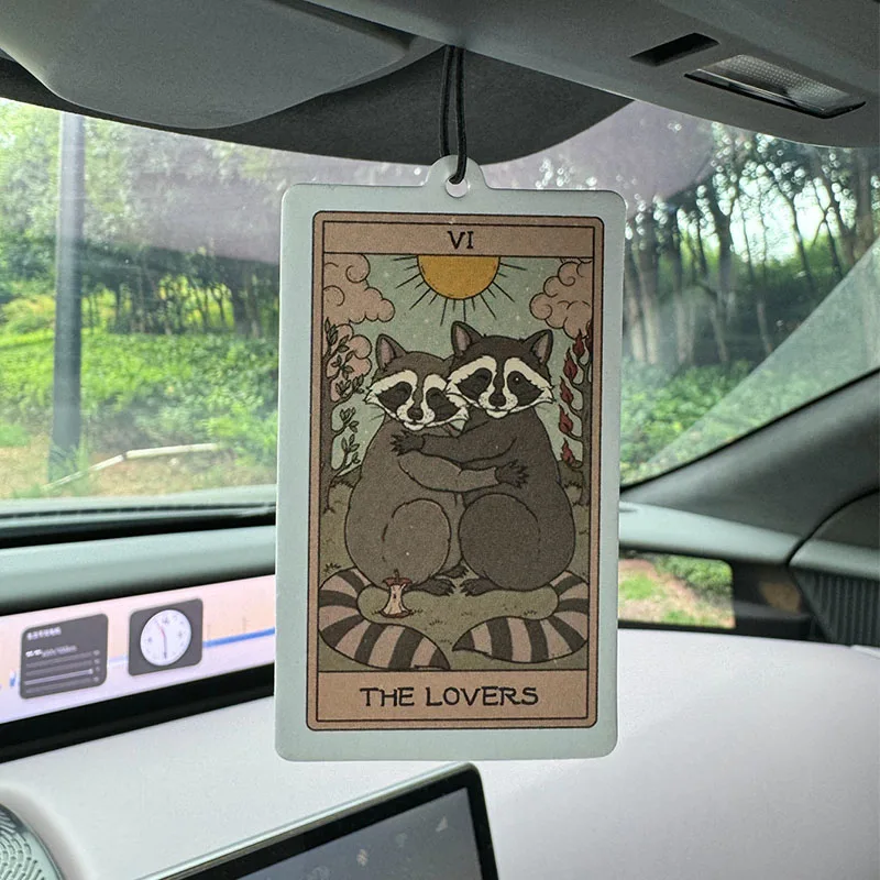 The Lovers - Raccoons Tarot Poster Hilton (Hotel Scent) Car Air Freshener |   Rearview Mirror Hanger & Dual-Purpose Air Vent Clip |   Natural Material Aromatherapy Tablets |   Long-Lasting Fragrance for 90 Days |   Alcohol-Free |   Not Afraid of the Sun Exposure |   Designed Specifically for Odor Removal in Cars, Closets, and Bathrooms. |   Cartoon Animation Graphics