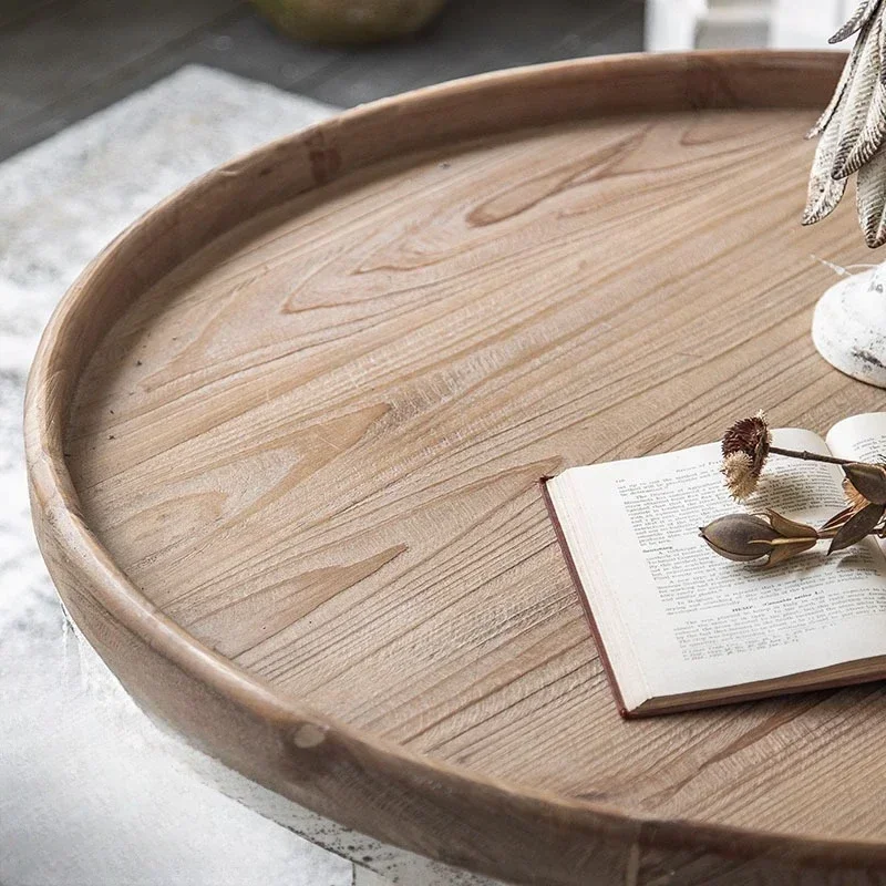 American retro hollow, solid wood coffee table, white in the living room of the B & B, simple log small round table
