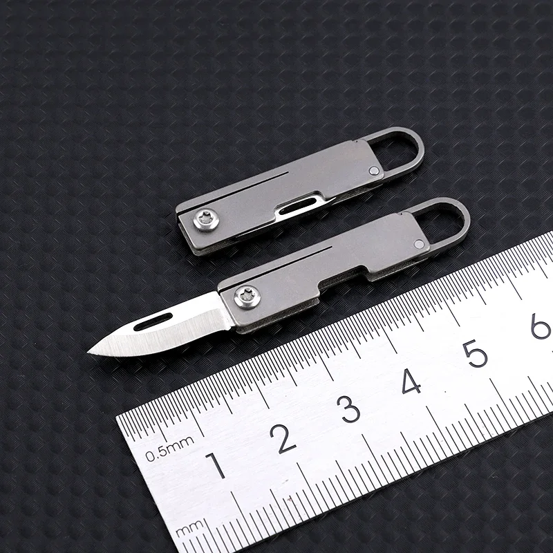 Imagem -02 - Titânio Liga Mini Faca Pingente Chaveiro Unboxing Portátil Sharp Mini Faca Dobrável
