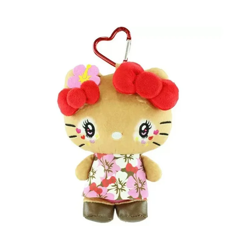 Ostrejka z czarną karną i opalenymi ramionami, breloczek z pluszową lalką w kształcie kotka, 15 cm.