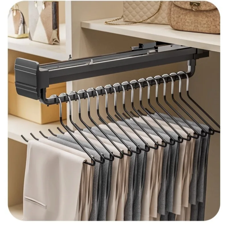 A topmounted hanger in a drawdown closet A thin wardrobe with a vertical hanger