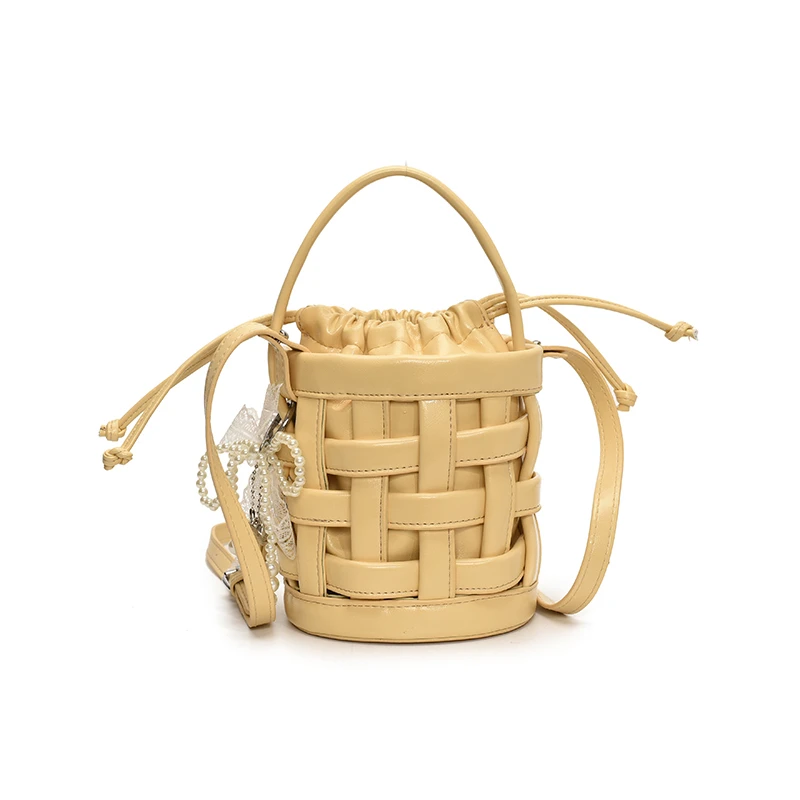 

Creative Hollow Out PU Leather Woven Bucket Bag Stylish Design Small Cylindrical Drawstring Crossbody Bag for Women 2025 Female