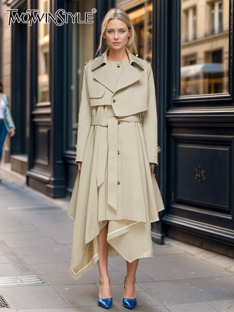 

TWOTWINSTYLE Solid Casual Designer Trench For Women Lapel Long Sleeve High Wiast Spliced Belt Asymmetrical Hem Long Coat Female