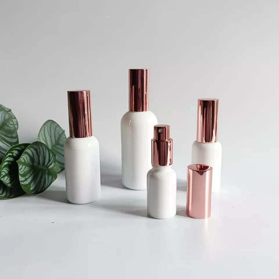 Empty 10ml 15ml 30ml 50ml 100ml Round Shape White Glass Perfume Hair Oil Spray Bottle with Rose Gold Sprayer Cosmetic Containers