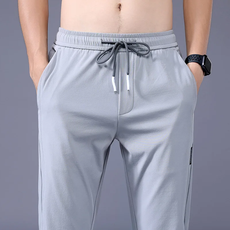 2024 Summer Ice Silk Thin Sports Pants Men's Straight Loose Elastic Non ironing Casual Pants Men's Work Wear Pants