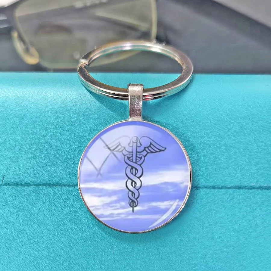Medical symbol creative gift pendant, keychain with snake pattern element design, trendy bag pendant