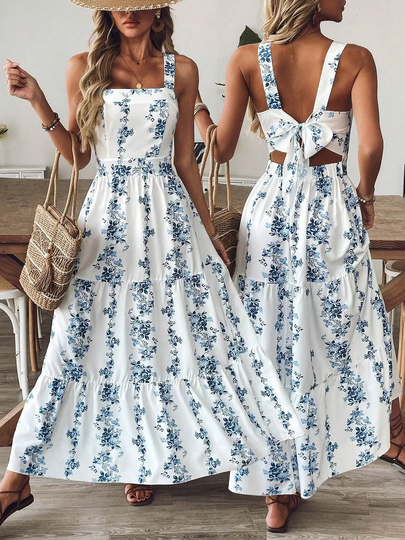 

Женское синее макси-платье без рукавов с цветочным принтом, многоярусной юбкой и бантом на спине