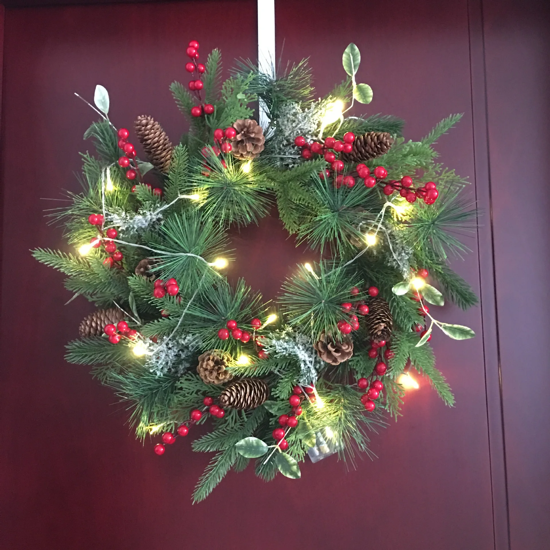 

Christmas wreath with lights, pine cones, red fruits, American door decorations, simulated Christmas wreath