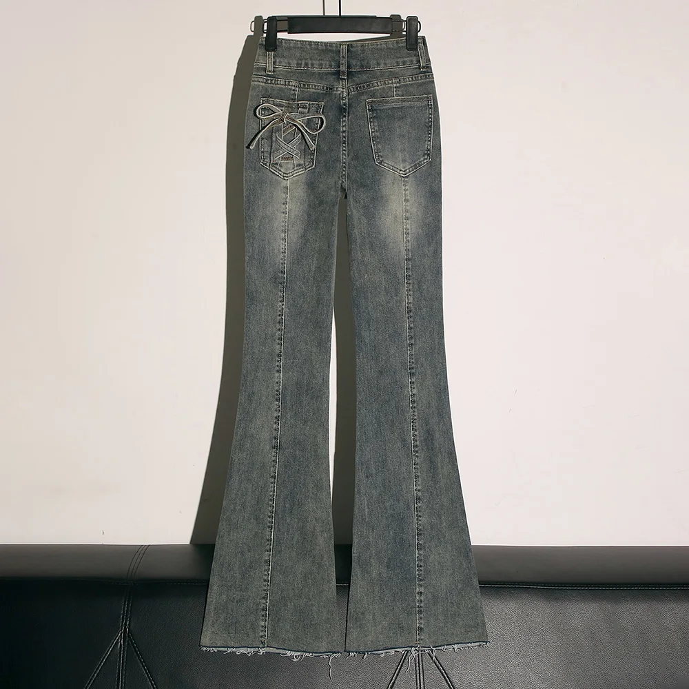 Retro blauwe slanke uitlopende jeans dames oversized Amerikaanse stijl hoge taille bandage boog ontwerp jeans denim broek met klokbodem