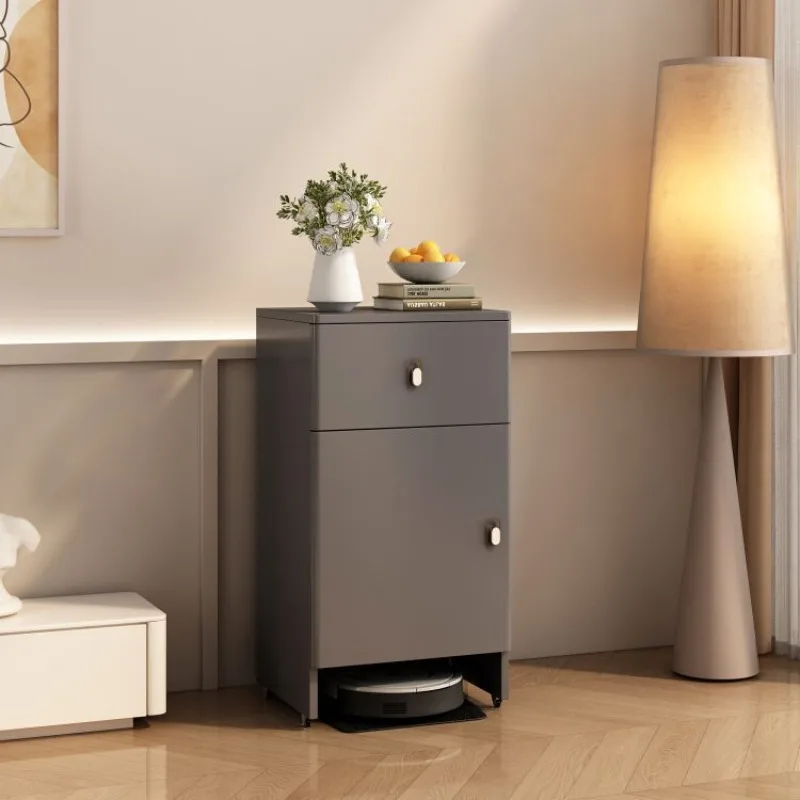 

minimalist small apartment with fish tank next to the cabinet, shelf, mini side table, and small mop.