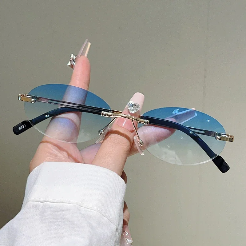 بدون شفة البيضاوي النظارات الشمسية النساء أزياء التدرج ديكور ظلال النظارات الجديدة العصرية خمر العلامة التجارية تصميم النظارات غير رسمية