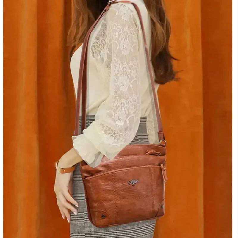 Bolso con textura de cuero suave para mujer, bandolera, nuevo bolso de hombro a la moda, tendencia Simple europea y americana, Retro, múltiples bolsillos