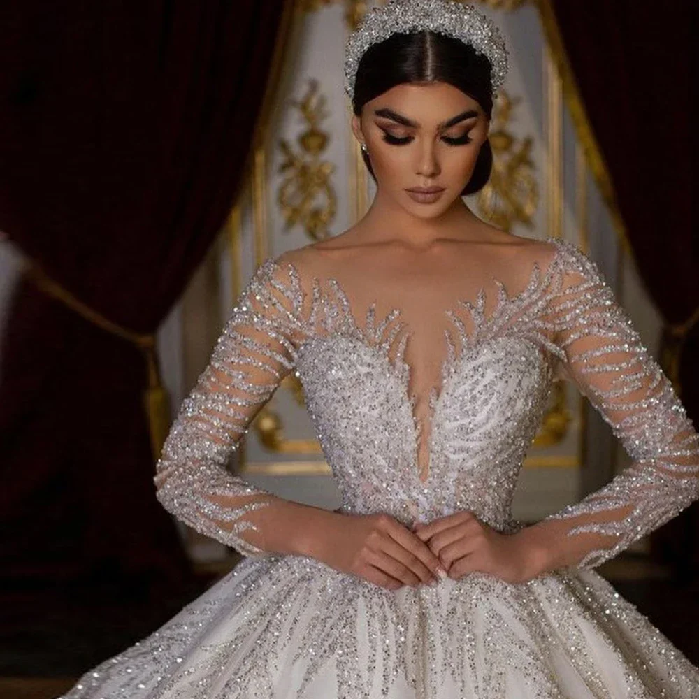 Shiny Arabic Dubai Wedding Dress 2026 Sheer O-neck Long Illusion Sleeves Sequins Tulle Birde Bridal Gowns Vestido De Novia