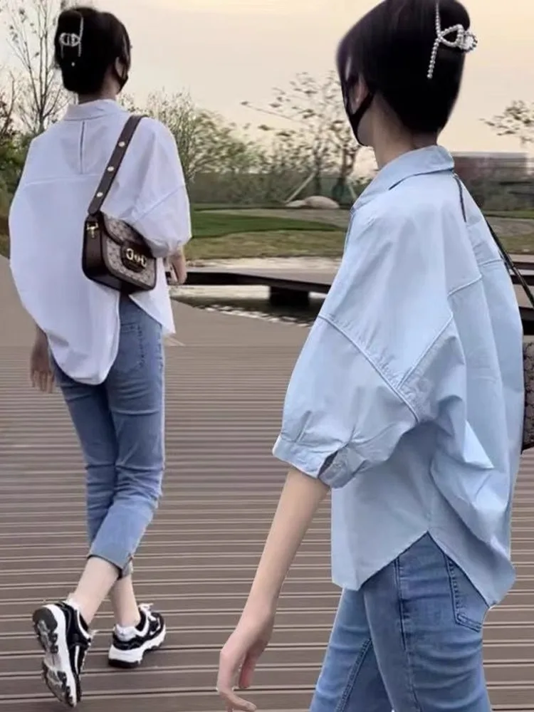 

Белая женская летняя рубашка с коротким рукавом: новая модель, элегантный свободный крой, эффектный дизайн для ценителей.