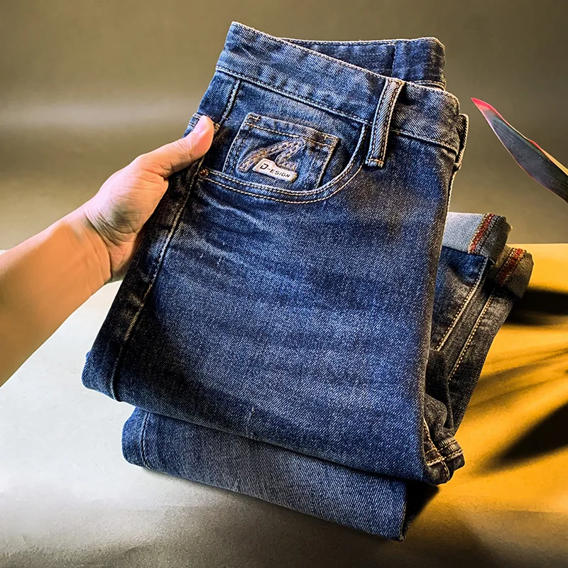 جينز رجالي راقي ملابس رجالية عصرية جينز مطاطي نمط جديد لخريف 2025 سروال أزرق غير رسمي