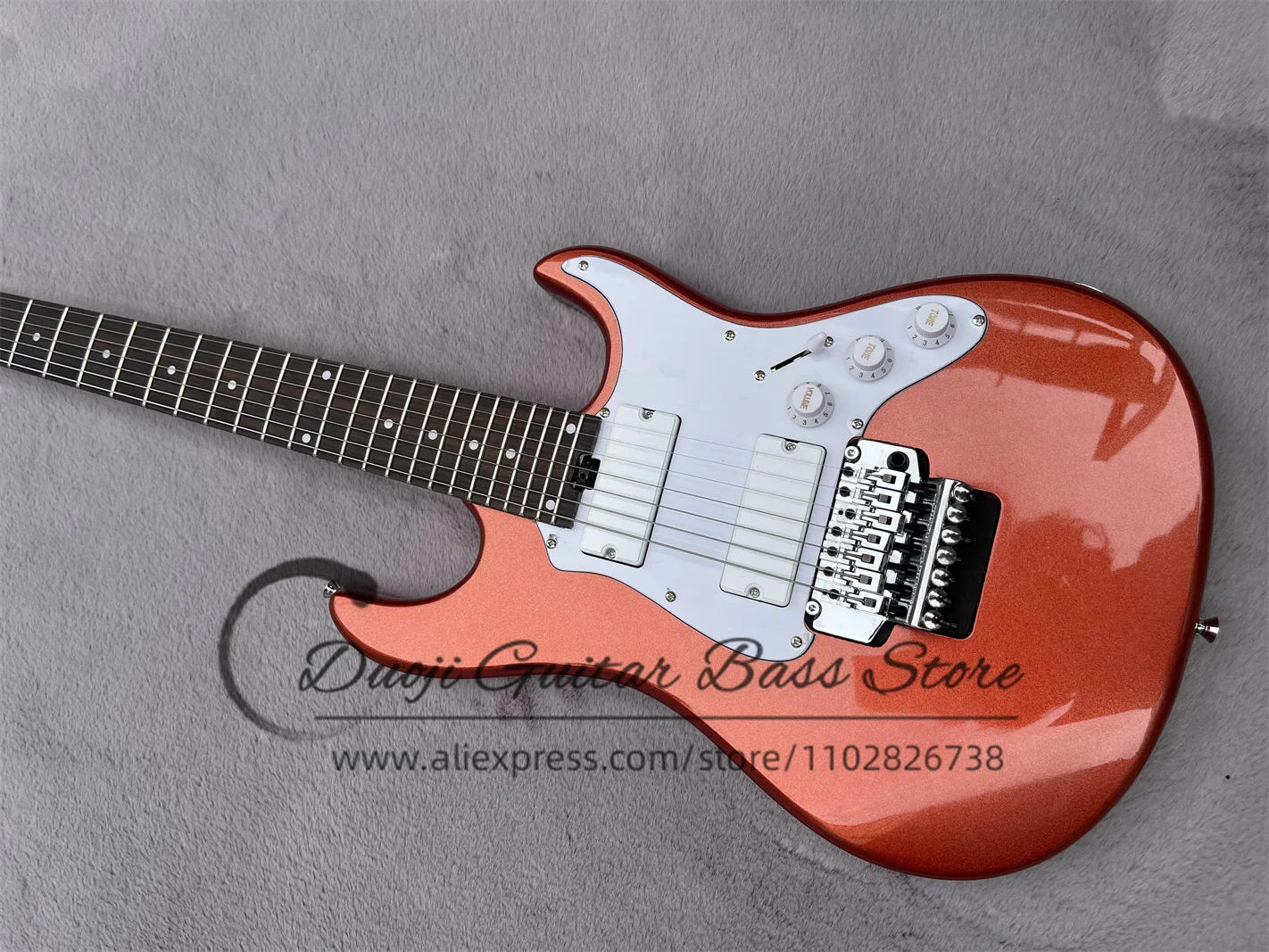Classic 7 string guitar, metallic orange red body, Tremolo bridge, white pickup, white pearl board, maple neck, factory custom