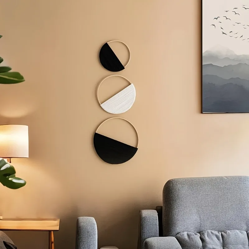 Three bohemian macrame wall shelves hanging in a living room