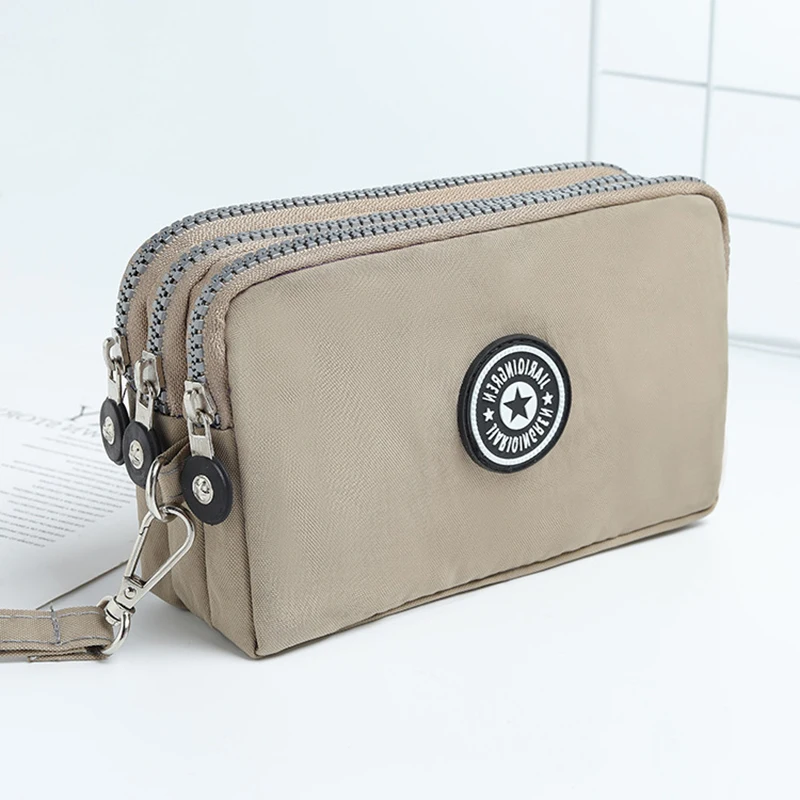 Petit portefeuille cosmétique pour femmes, porte-monnaie en tissu déformable, trois fermetures éclair, trousse de maquillage portable, 18 couleurs,