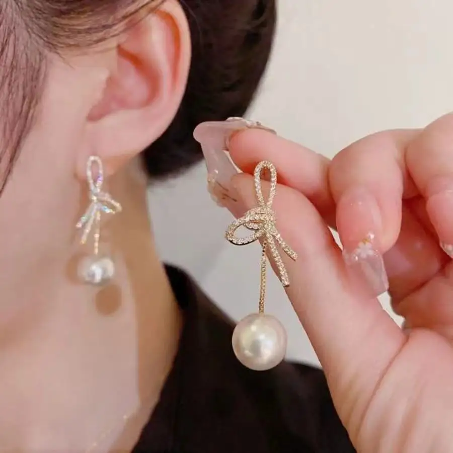 1 pair of bow tassel imitation pearl earrings with a niche design, delicate and cute shape, suitable for women\'s daily wear