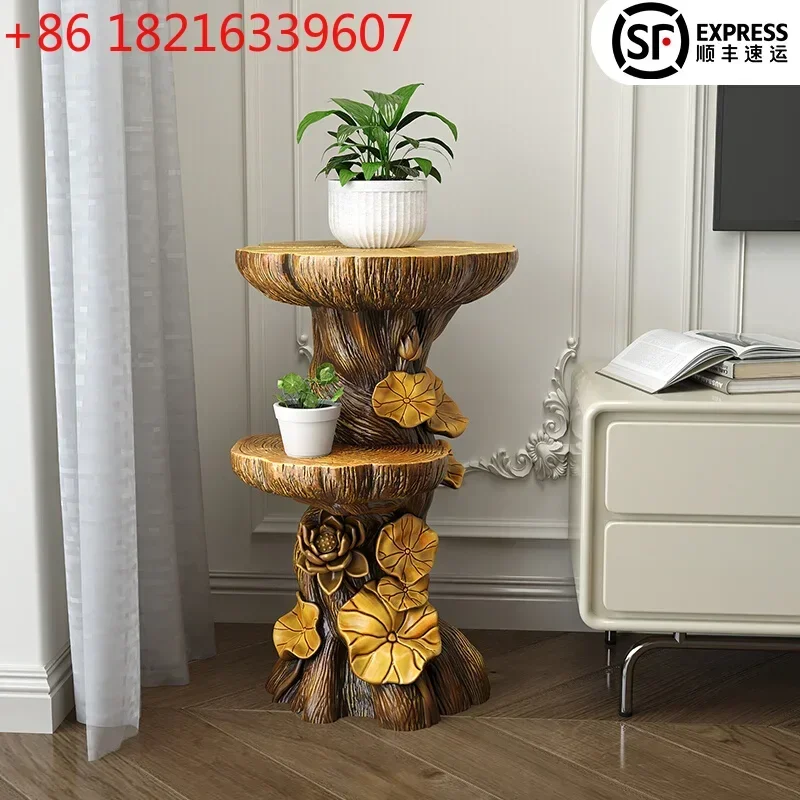 Living room large floor-to-ceiling ornament wood TV cabinet next to home decoration potted plants