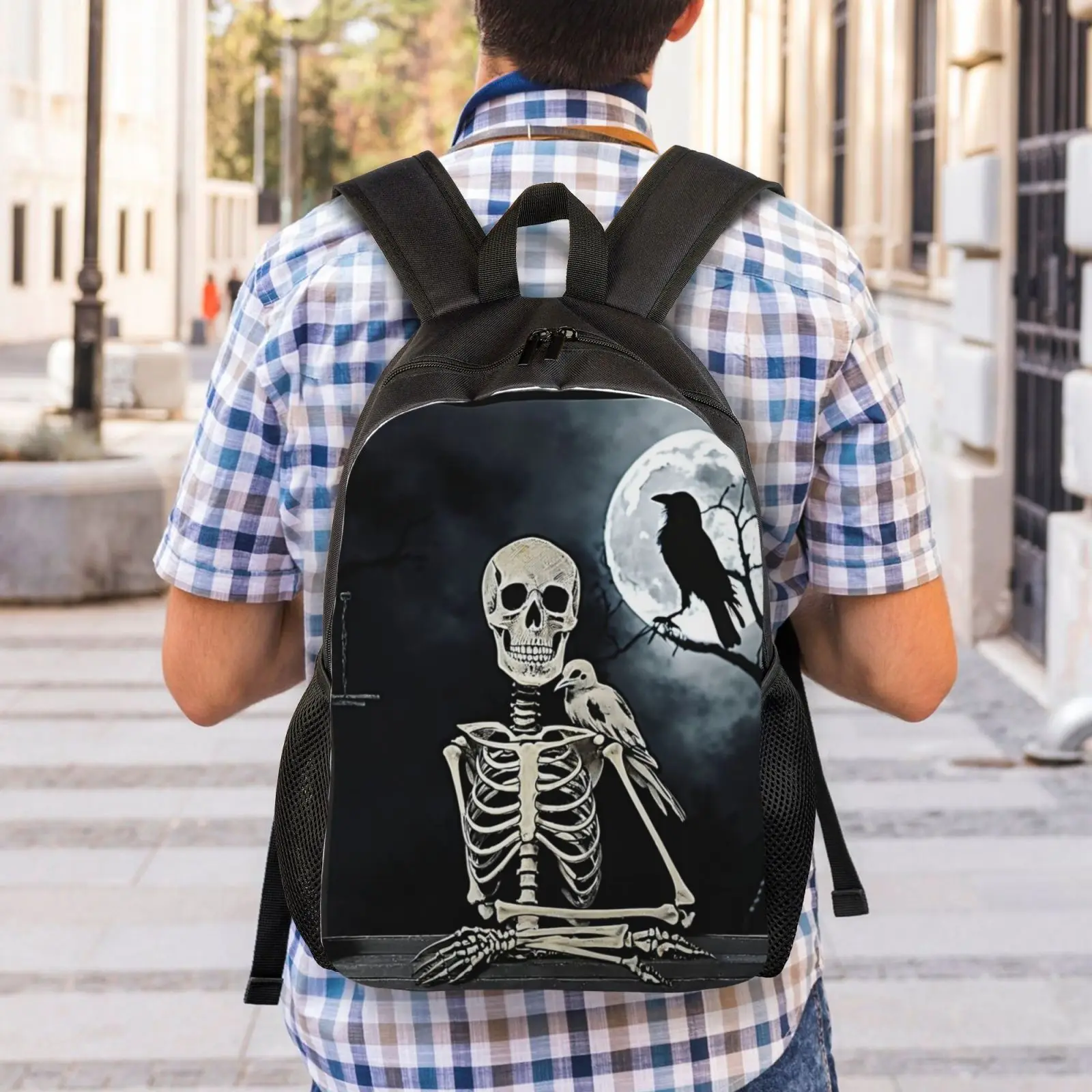 A fashionable black backpack with skull crow print suitable for both men and women, lightweight and adjustable