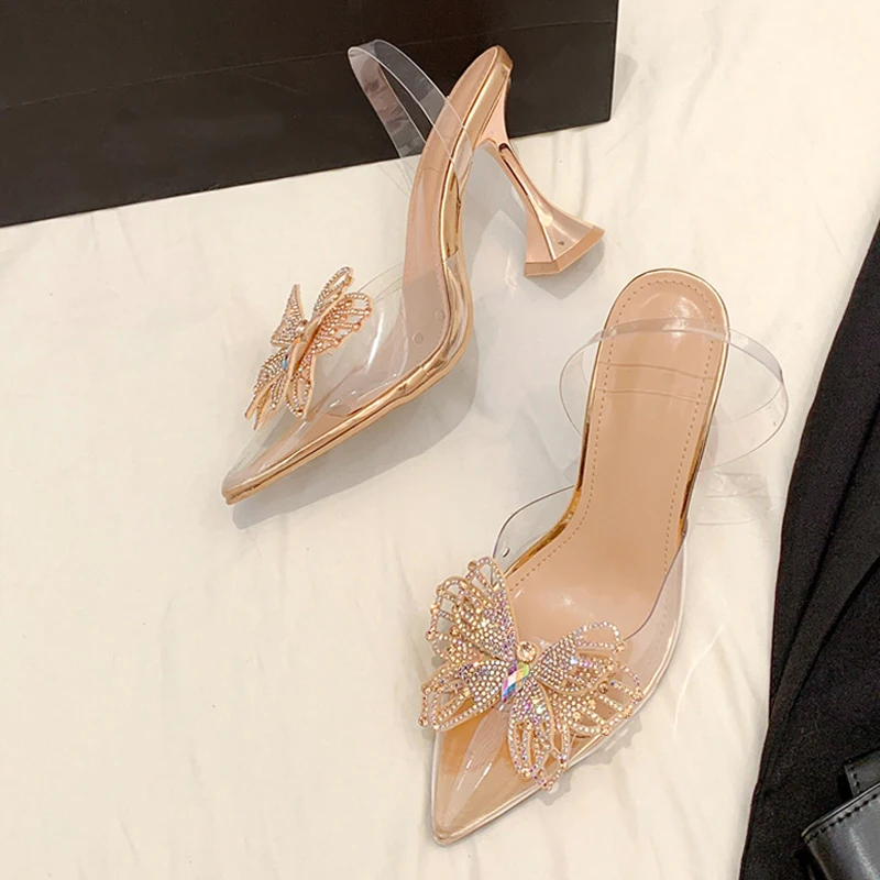 

Элегантные туфли Liyke с острым носком на необычном высоком каблуке, свадебные/выпускные туфли, модные женские туфли-лодочки с бабочками из страз, прозрачные сандалии из ПВХ