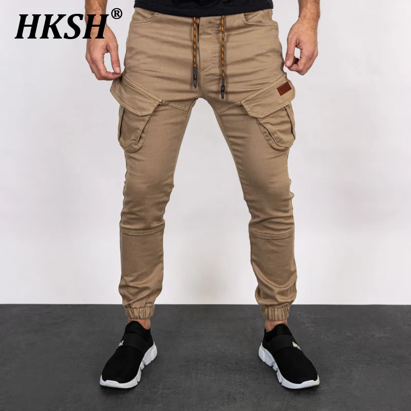 

HKSH Men's Tide Solid Color Slim Large Pocket Tie Feet Safari Style Cargo Pants Large Casual Sports Fashion Ins Trousers HK1543