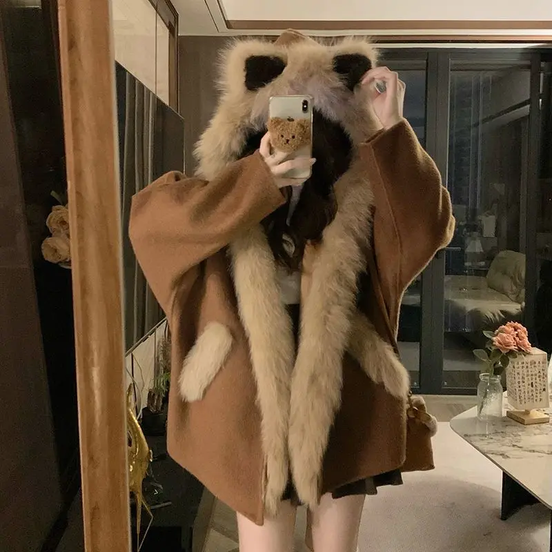 Dwustronny płaszcz wełniany z kapturem dla kobiet na zimę 2025, nowy, luźny i uroczy płaszcz z bawełny z uszami owiec, idealny do dojazdów do pracy.