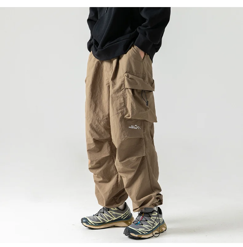 Men's Outdoor Splash-Resistant Casual Pants Autumn Patchwork Soft Pockets Drawstring Loose-Fit Straight-Leg Pants.