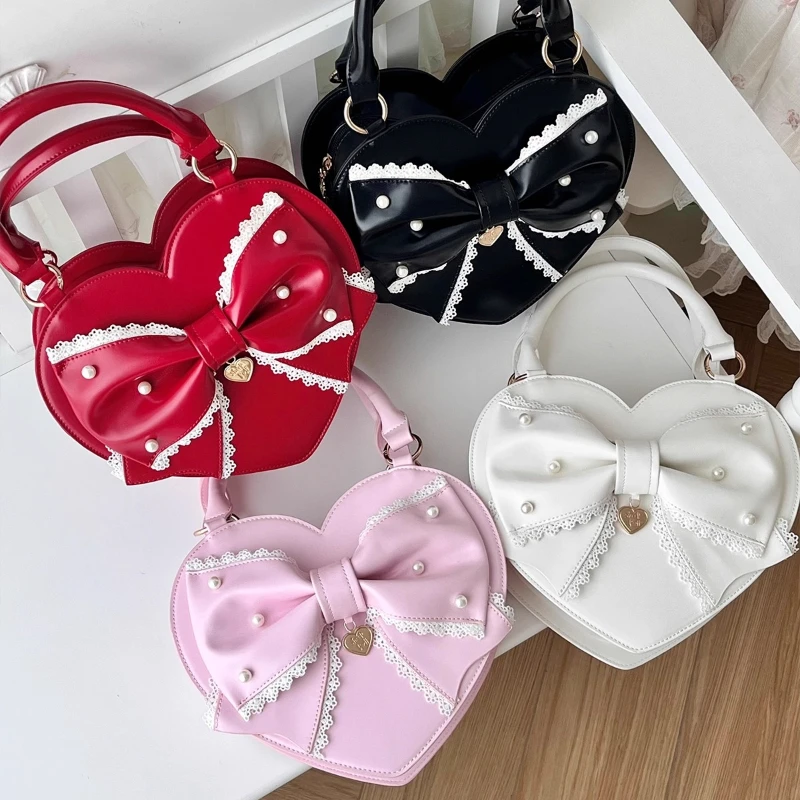 الفتاة الأميرة الحلو لوليتا شكل قلب حقيبة يد 2025 امرأة جديدة حلوة أنيقة القوس الكبير حقائب كروسبودي دمية يشعر حقيبة كتف