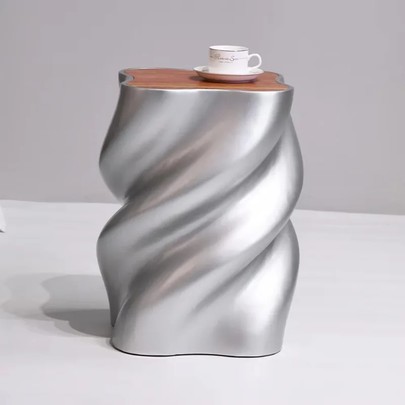 Sculptural side tables with a twisted wavy base and a luxurious art style, are suitable for home interior decoration.