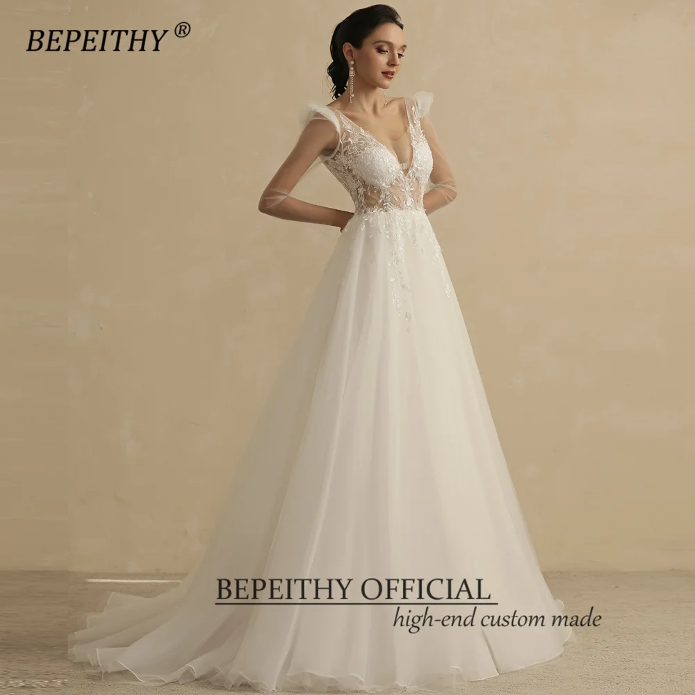 BEPEITHY V คอยาวแขน Boho ชุดแต่งงานสําหรับผู้หญิง 2023 เจ้าสาวสายเปิดกลับเซ็กซี่แปลกชุดเจ้าสาวชายหาด ...