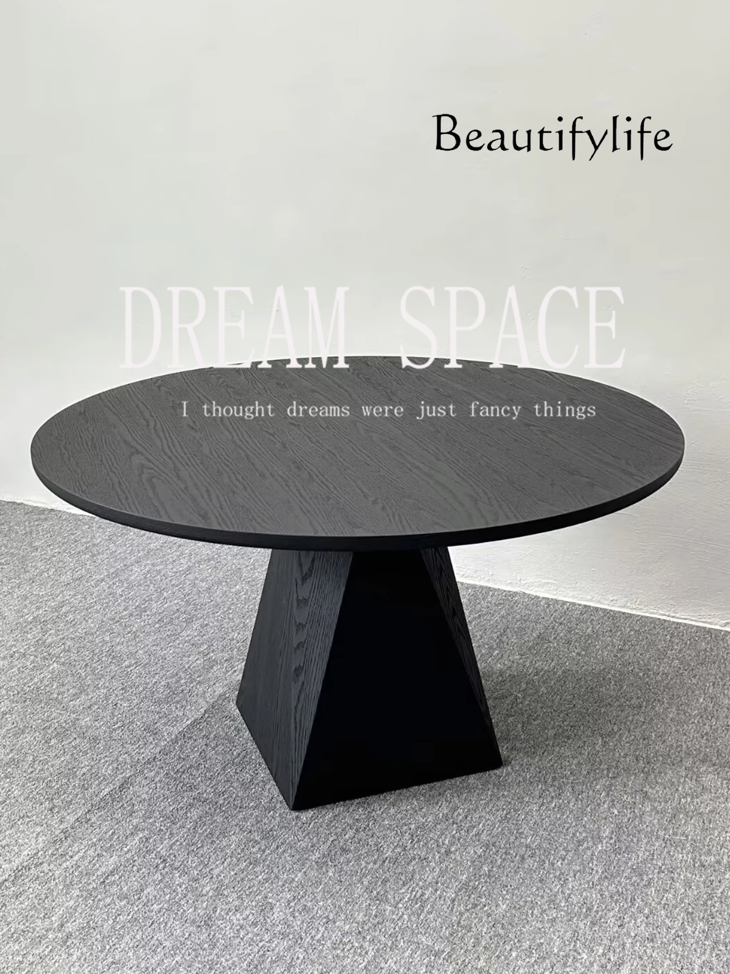 

Medieval black round dining table designer creative solid wood dining table small apartment ash wood high-end