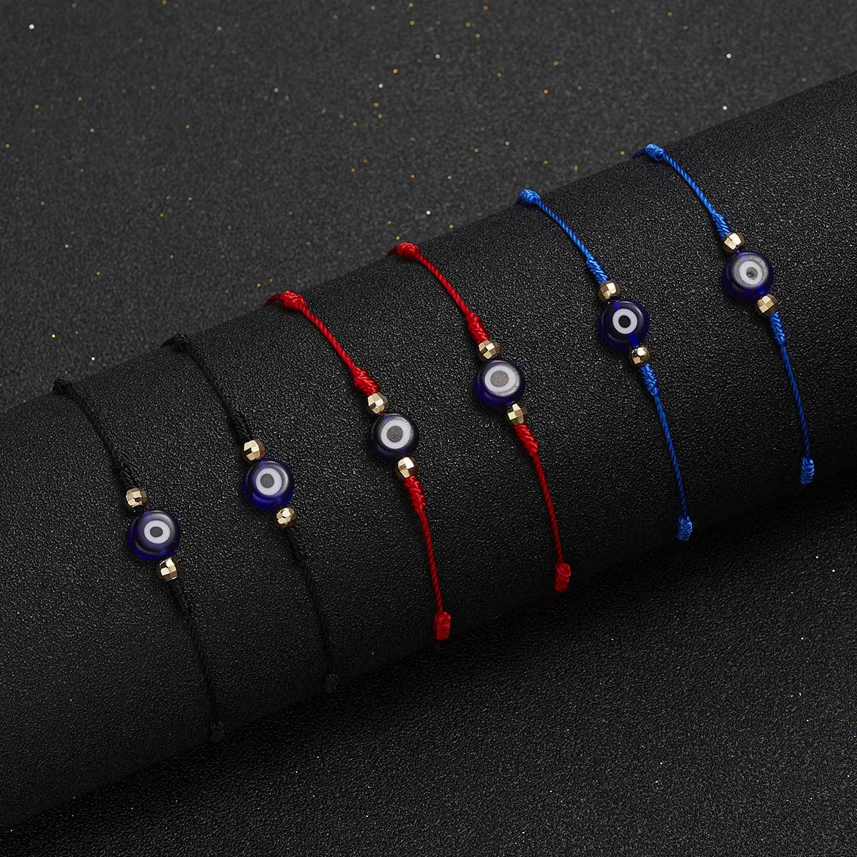 New six-piece set (in red, blue and black colors) with woven design and eye-catching evil eye decoration. Lucky and fr