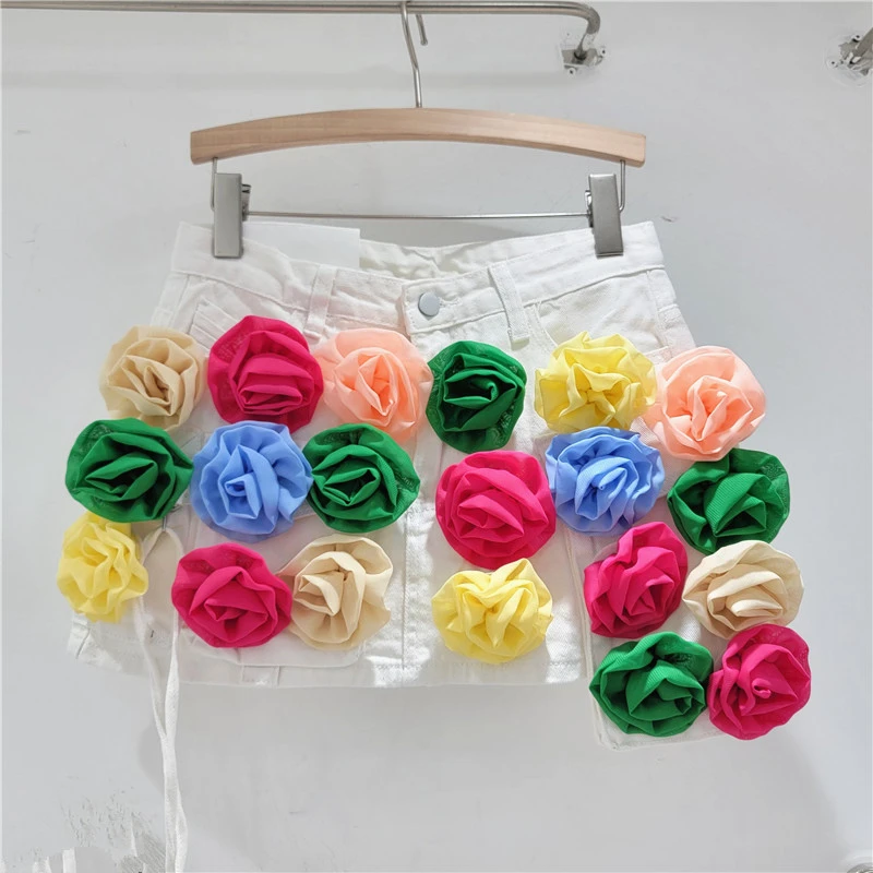Gonna di jeans con utensili irregolari a fiori tridimensionali di colore a vita alta che dimagrisce gonna a tubino anti-marca per le donne