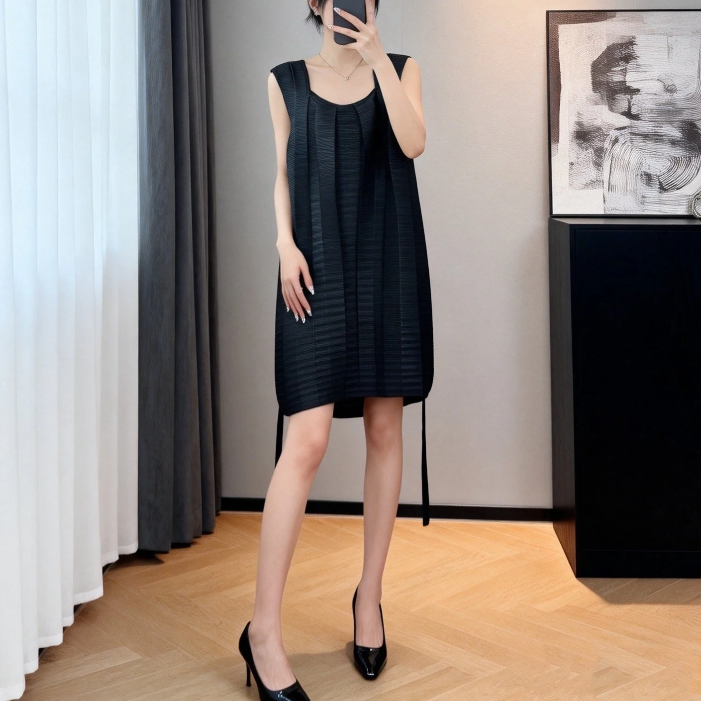 Miyake Pleated Black Mini Dress with Sleeveless Design Round Neckline Loose Silhouette and Textured Fabric for Elegant Style