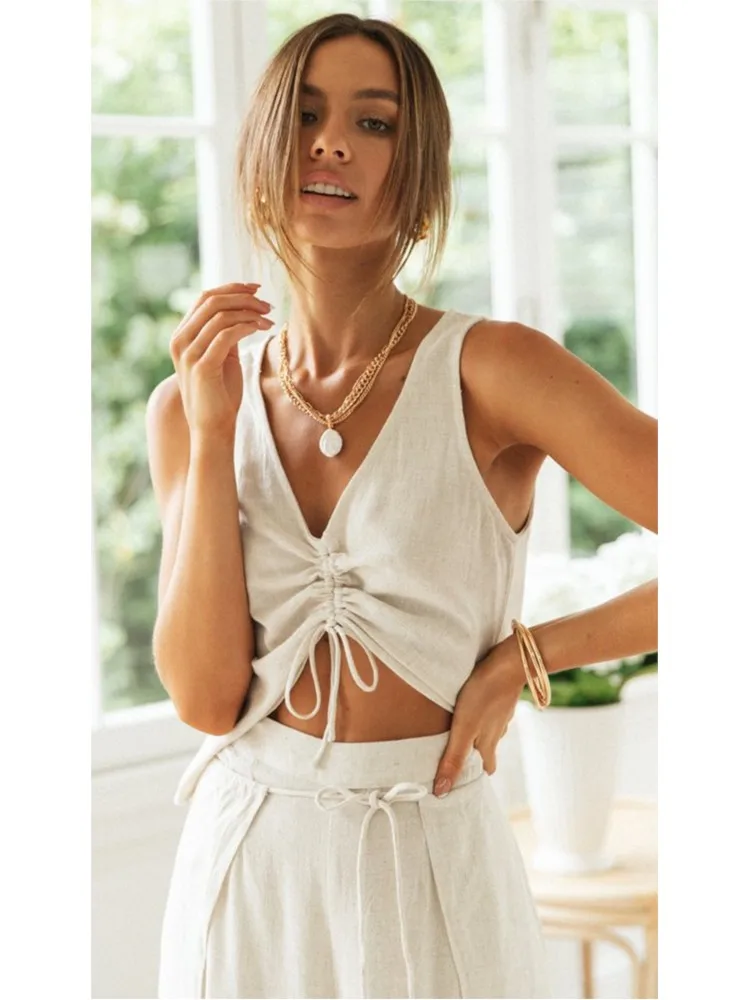 Letni dwuczęściowy zestaw damski w jednolitym kolorze z dekoltem w serek, modny bezrękawnik z sznurowaniem + spodnie z szerokimi nogawkami, elegancki strój do biura.