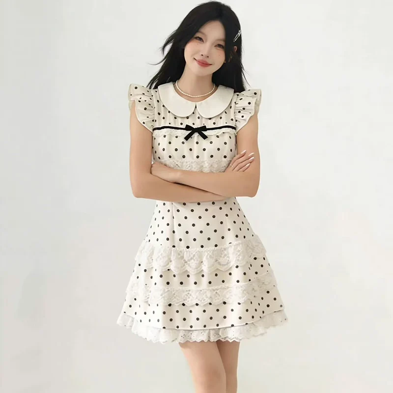 Vestido de verano 2026 estilo francés con cuello Peter Pan, lunares y encaje para mujer, ajuste ceñido y elegante, con mangas voladas.