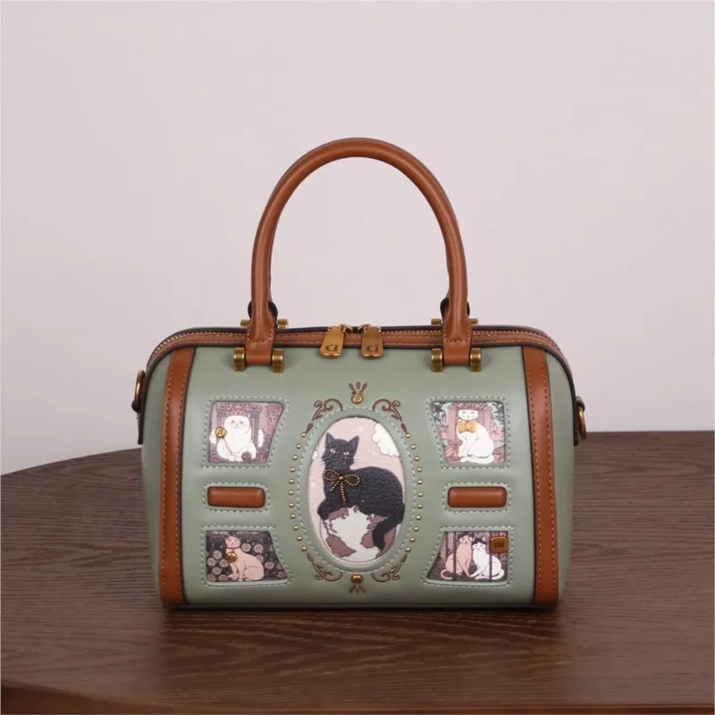 

Luxury and Fashion Handheld Boston Bag with Delicate Cat Pattern and High Quality Leather 2026 Women Newly Trendy Crossbody Bag