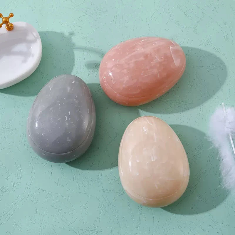 

1pc/ Egg-shaped Marble Hair Comb (Random color)- Portable egg-shaped hair comb for smooth and fashionable hair massage