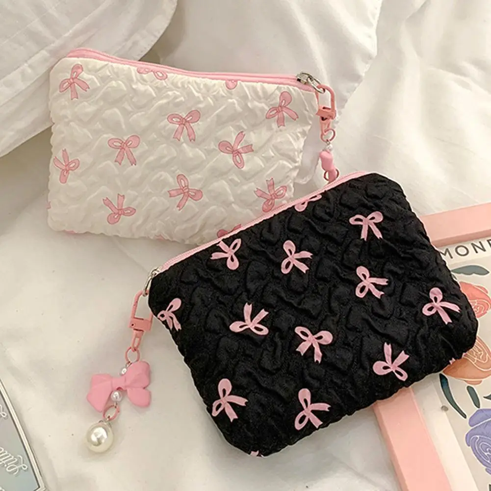 Bolsa de maquillaje de mano pequeña para mujer, bolsa de almacenamiento de servilletas sanitarias con estampado de lazo rosa y negro, tarjeta de lápiz labial conveniente, Mini estuche