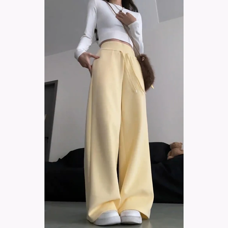 กางเกงฮาเร็มลำลองสีเหลืองนมสำหรับผู้หญิง ฤดูใบไม้ผลิ-ฤดูร้อน 2025 รุ่นใหม่ ช่วยลดเลือนริ้วรอย ทรงหลวมพลิ้ว ช่วยให้ดูผอมเพรียว ทรงกระดิ่ง แฟชั่นเกาหลี...