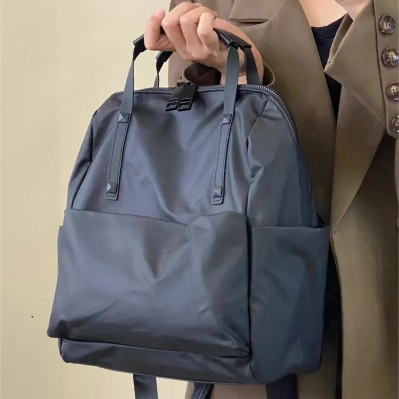 حقيبة ظهر JIAERDI من النايلون الأسود للنساء مقاومة للماء وخفيفة الوزن وسعة كبيرة حقيبة يد عصرية متعددة الاستخدامات للتنقل اليومي #1