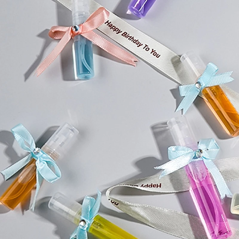 50 Uds 2ml Mini botella pulverizadora de niebla fina atomizador de Perfume recargable portátil subenvase de viaje para limpieza separador de regalo