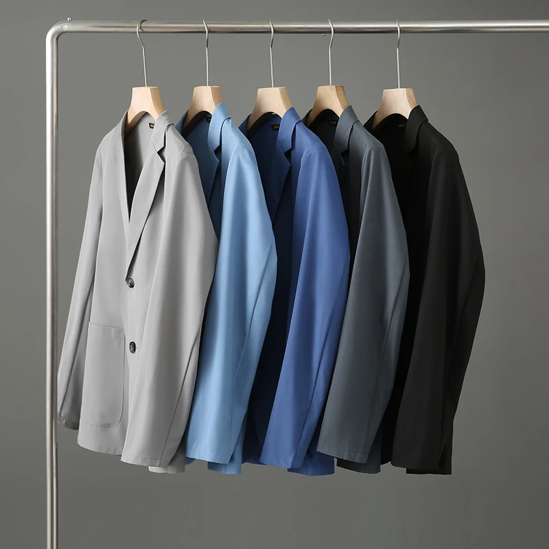 

Легкий дышащий мужской деловой повседневный костюм-пиджак для весны и лета, модный городской стиль, приталенный крой, длинный рукав, два кармана.