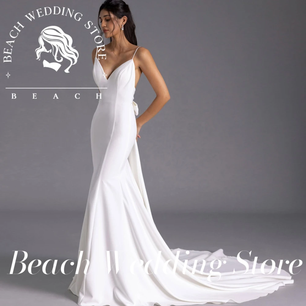 Robe de mariée sirène personnalisée, magasin de mariage sur la plage, bretelles Spaghetti, avec décolleté en V profond, dos ouvert et grand nœud détail