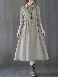 Black and white small plaid flip tie button waist closure large pocket long sleeved dress