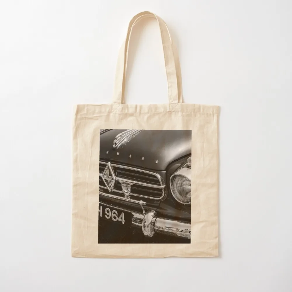 

A black and white image of the front of a 1959 Borgward Isabella on display at a car show Tote Bag canvas shopping bag great bag