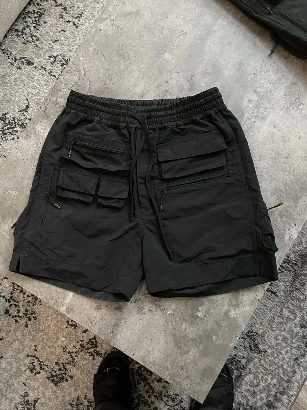 Amerykańskie luźne spodnie męskie w stylu high street, letnie, modne, wielofunkcyjne spodnie robocze do kolan.